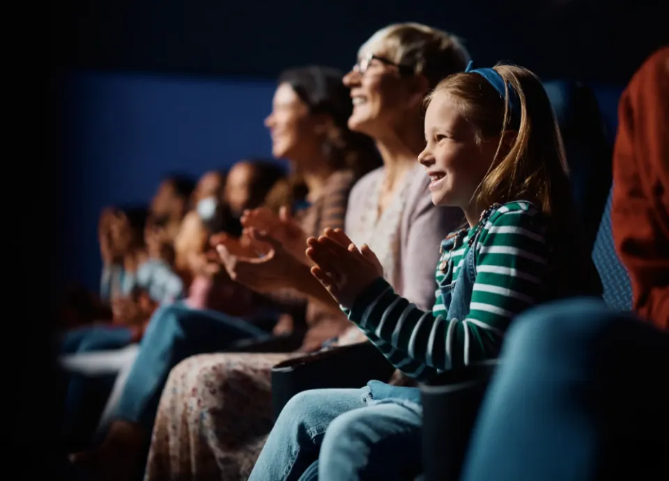 A mother and daughter laughing together in a Branson theater